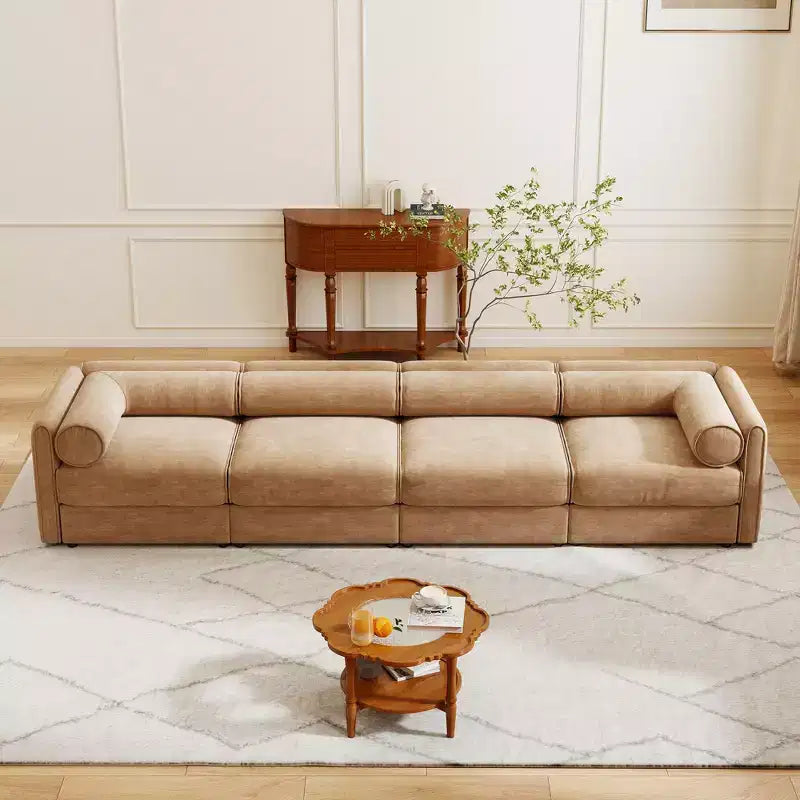 Canapé modulable avec rangement, dossier cylindrique et accoudoirs, assise profonde et confortable, durable et offrant un bon soutien pour le salon.