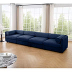 Canapé modulable avec rangement, dossier cylindrique et accoudoirs, assise profonde et confortable, durable et offrant un bon soutien pour le salon.