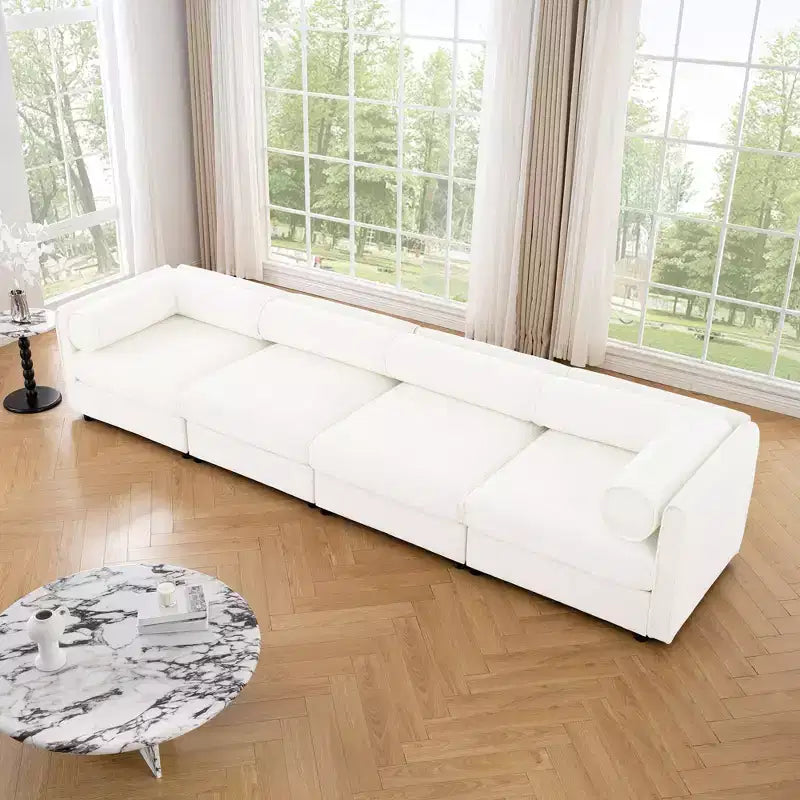 Canapé modulable avec rangement, dossier cylindrique et accoudoirs, assise profonde et confortable, durable et offrant un bon soutien pour le salon.