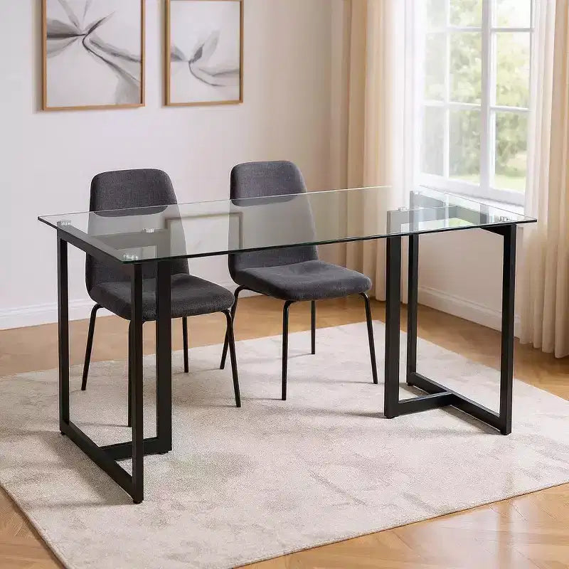 Table de salle à manger HomeRoots 55 en verre transparent et noir et métal