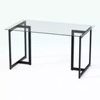Table de salle à manger HomeRoots 55 en verre transparent et noir et métal